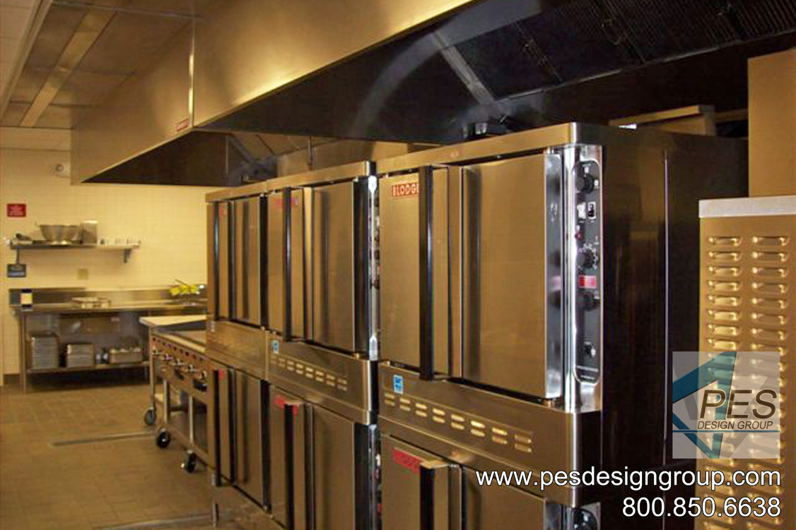 A bank of double deck convection ovens in a high school kitchen design