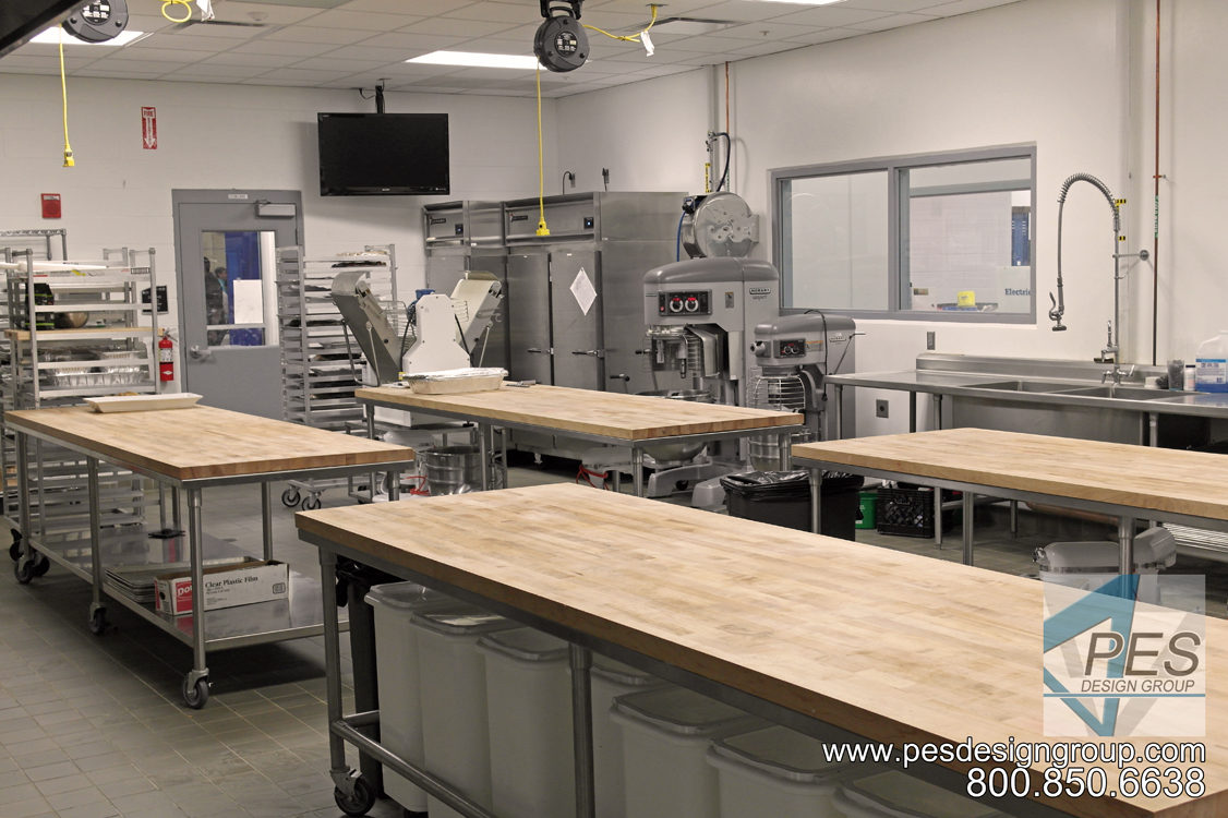 Prep tables and mixer in the bakery at Manatee Technical College's culinary teaching kitchen in Bradenton Florida.